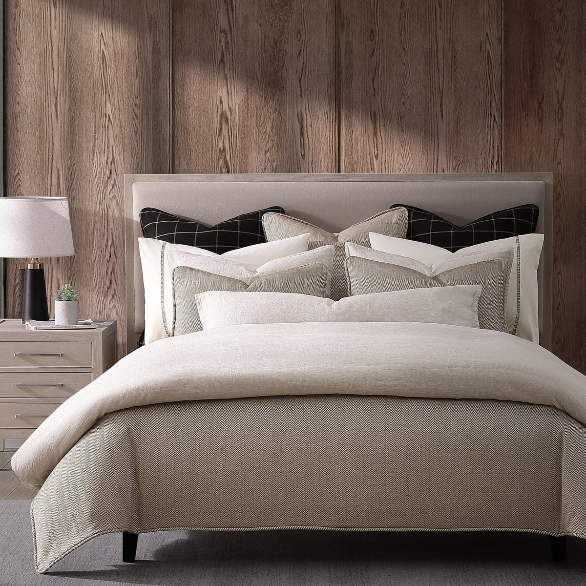 Chenille Herringbone bedding in a warm modern rustic room