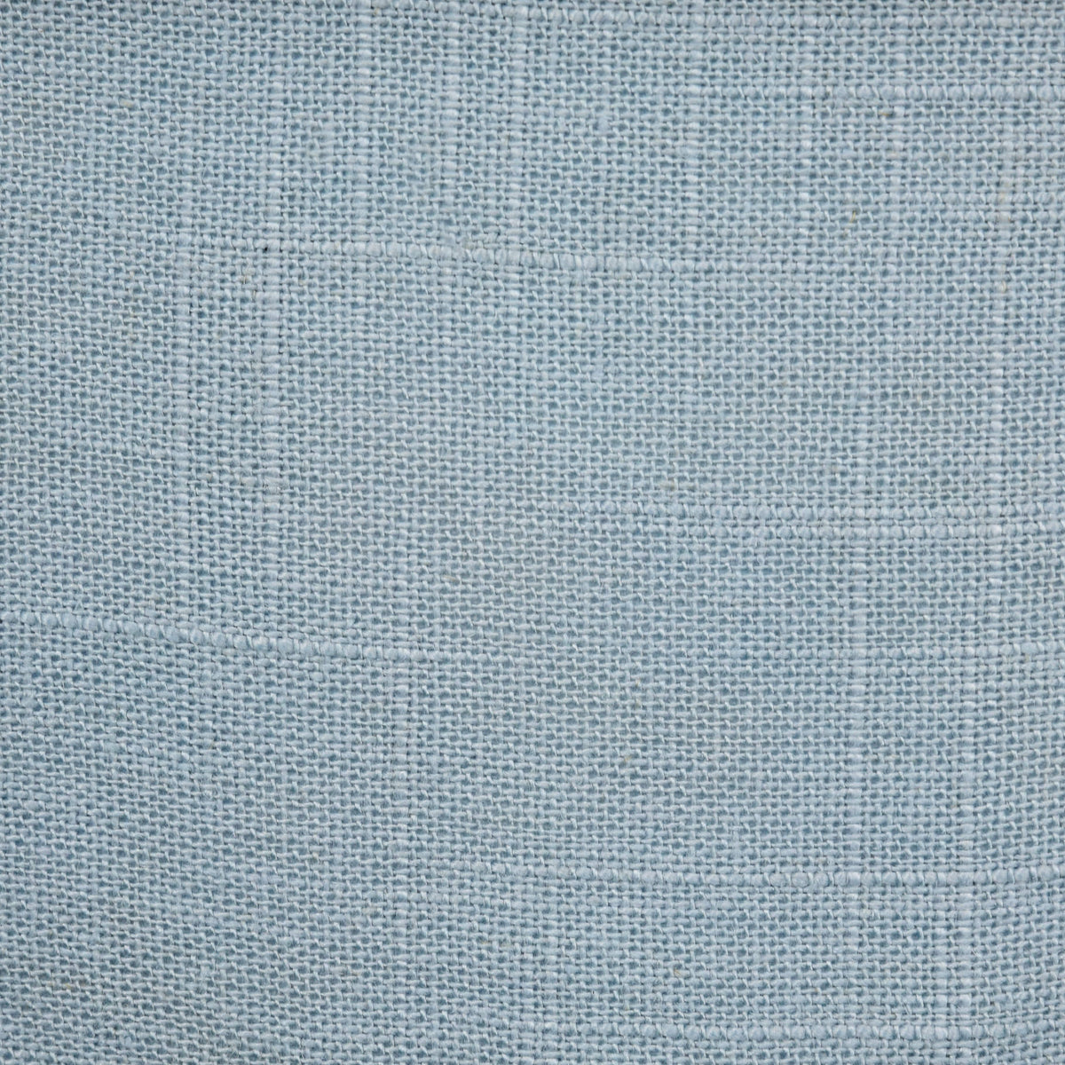 Close-up of the washed linen blend in light blue, showing the natural slub of the linen